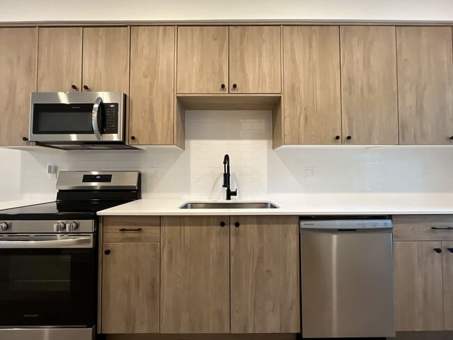 Building Photo - Modern 2-Bed, 1.5-Bath Condo with Custom Kitchen, Private Patio, and Prime Location