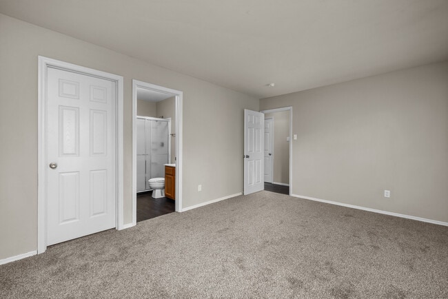 Two Bedroom Garden Partial Remodel with Fireplace | Bedroom with En Suite Bathroom and Walk In Closet - Woods Mill Park Apartments & Townhomes