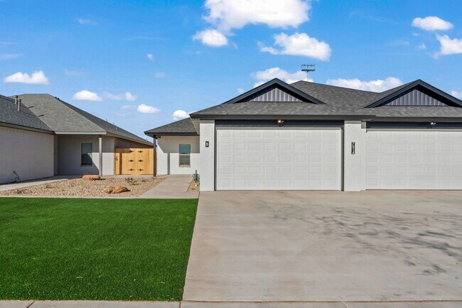 Building Photo - Like-new duplex in Frenship East!