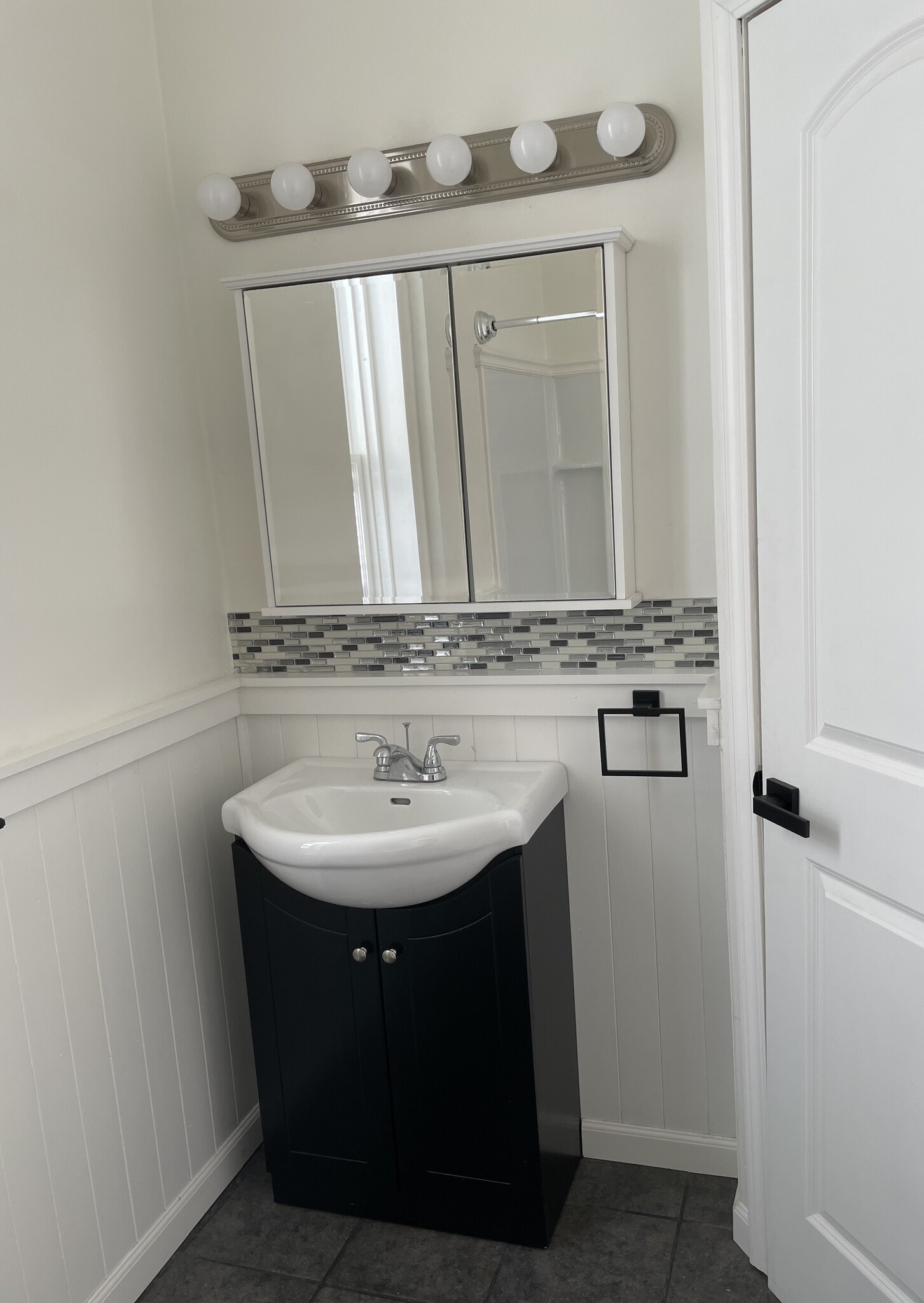 Bathroom has new fixtures and new tile floor - 810 E Washington St