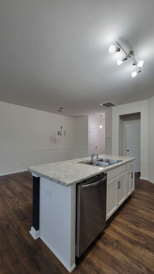 Building Photo - "Modern 3-Bedroom Multiplex with 3 Full Ba...