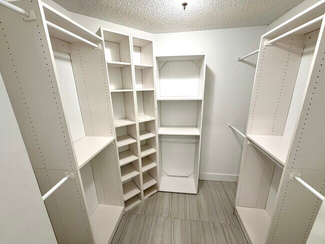 Master bedroom walk-in closet - 12187 Cuddington Ct