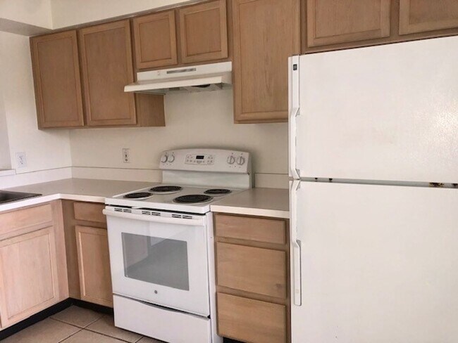 Building Photo - Nice 2X2 located on 2nd floor- Tile & lami...