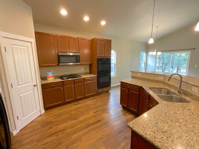Building Photo - 4 Bedroom Home Available Near Woodmoor Dr ...