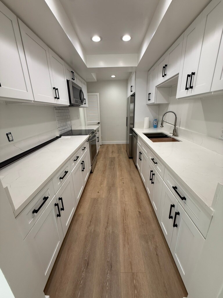 Tons of kitchen storage with ample countertop space - 1203 N Sweetzer Ave