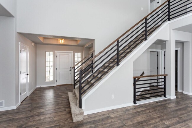 Building Photo - Exceptional 4-Bedroom Home with Dual Fireplaces, Main Level Master Suite, and Spacious Basement -...