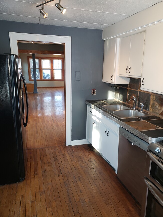 kitchen with stone countertop - 3231 Ulysses St NE