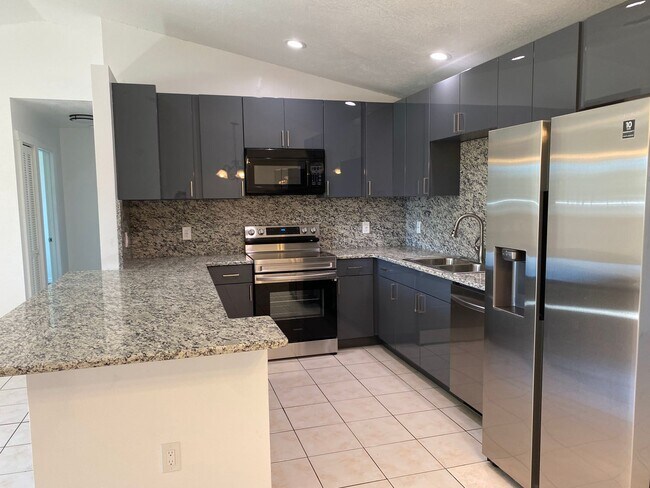 Primary Photo - FULLY RENOVATED and spacious 4-bedroom, 2-...