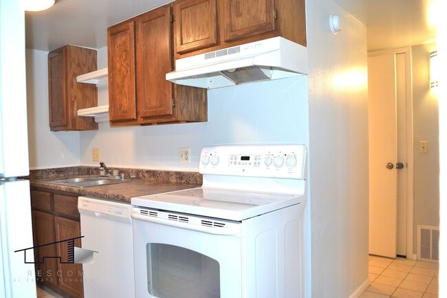 Building Photo - Lower-Level Roy 2 Bedroom, 1 Bathroom Condo Available!
