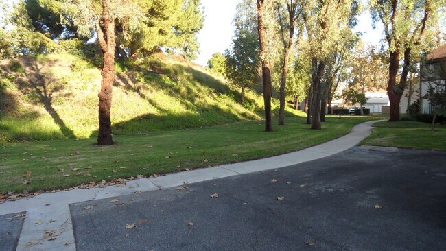 Building Photo - REMODELED 2BR; 1BA end unit condo w/ 1 car garage & 1 parking space