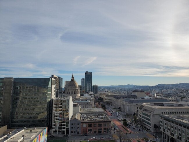 Building Photo - Downtown High-Rise Studio with parking and in-home laundry