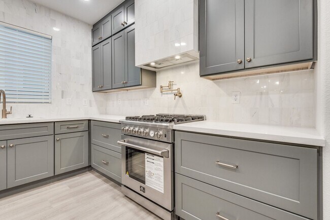 Building Photo - FULLY FURNISHED! Exudes sophistication with designer touches throughout