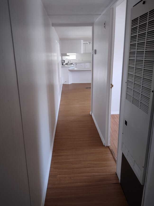 HALLWAY FROM BEDROOMS TO LIVING ROOM - 6520 Sun Country Dr