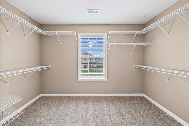 Building Photo - Four Bedroom with Three Car Garage!