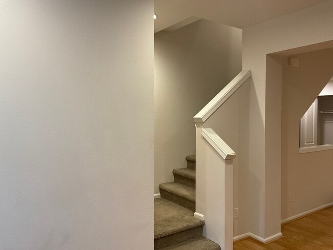 Building Photo - Riverfront Townhome with Tandem Garage & Fenced Yard