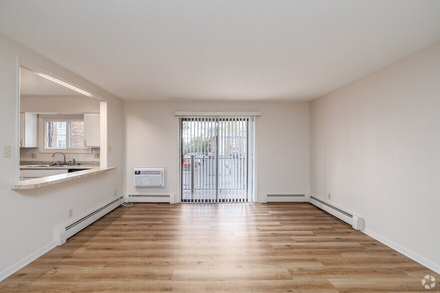 2BR, 1.5BA - 1,051SF - Living Room - Brentwood Village Apartments