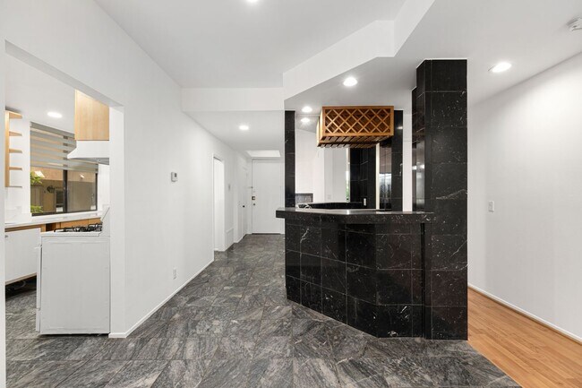 Entry way, view 3 - Interior, powder room, walk-through galley kitchen, wet bar - 1745 S Bentley Ave