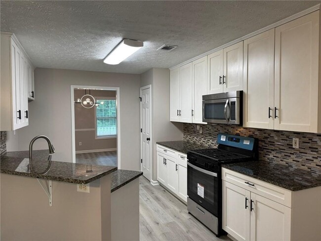 Building Photo - 7454 Woody Springs Dr