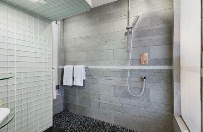 Building Photo - One-of-a-Kind Sophisticated Top-Floor Cond...