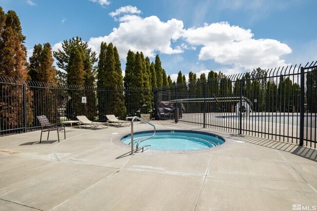 Building Photo - Discover Your Dream Condo with Stunning Mountain Views a 1 Car Garage & Covered carport in NW Ren...