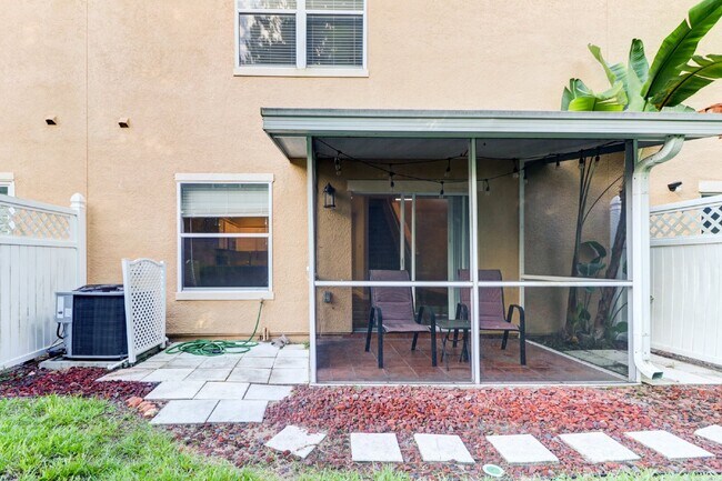 Building Photo - Gated Tampa Palms Townhome with 2-Car Garage, Screened Lanai & Community Pool