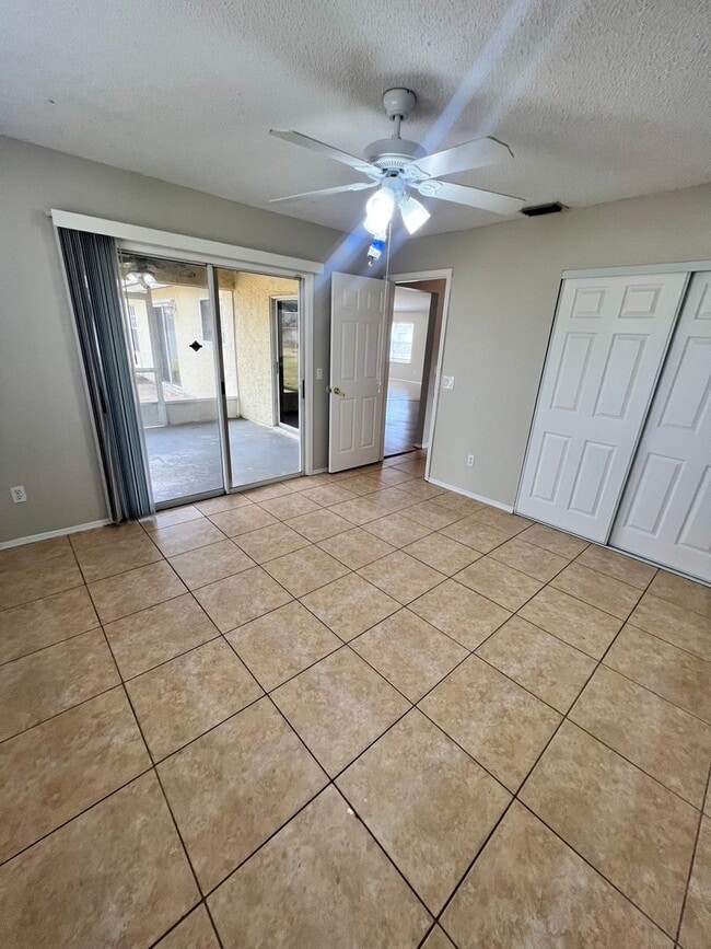 Building Photo - COZY 3 BEDROOM, 2 BATH HOME WITH TILE & LAMINATE THROUGHOUT, PRIVATE SCREENED PATIO