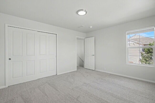 Building Photo - Beautifully Updated 3-Bedroom End-Unit Townhome Facing Open Space with Attached 2-Car Garage in G...