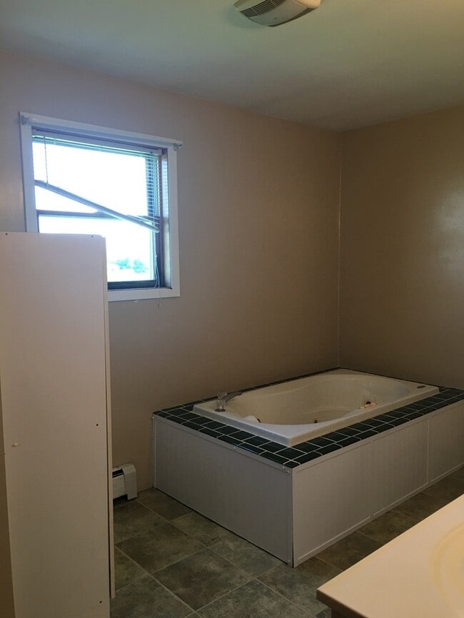 Building Photo - Beautiful secluded 4 bedroom 2.5 bath home with 2 stall detached garage and descent sized yard