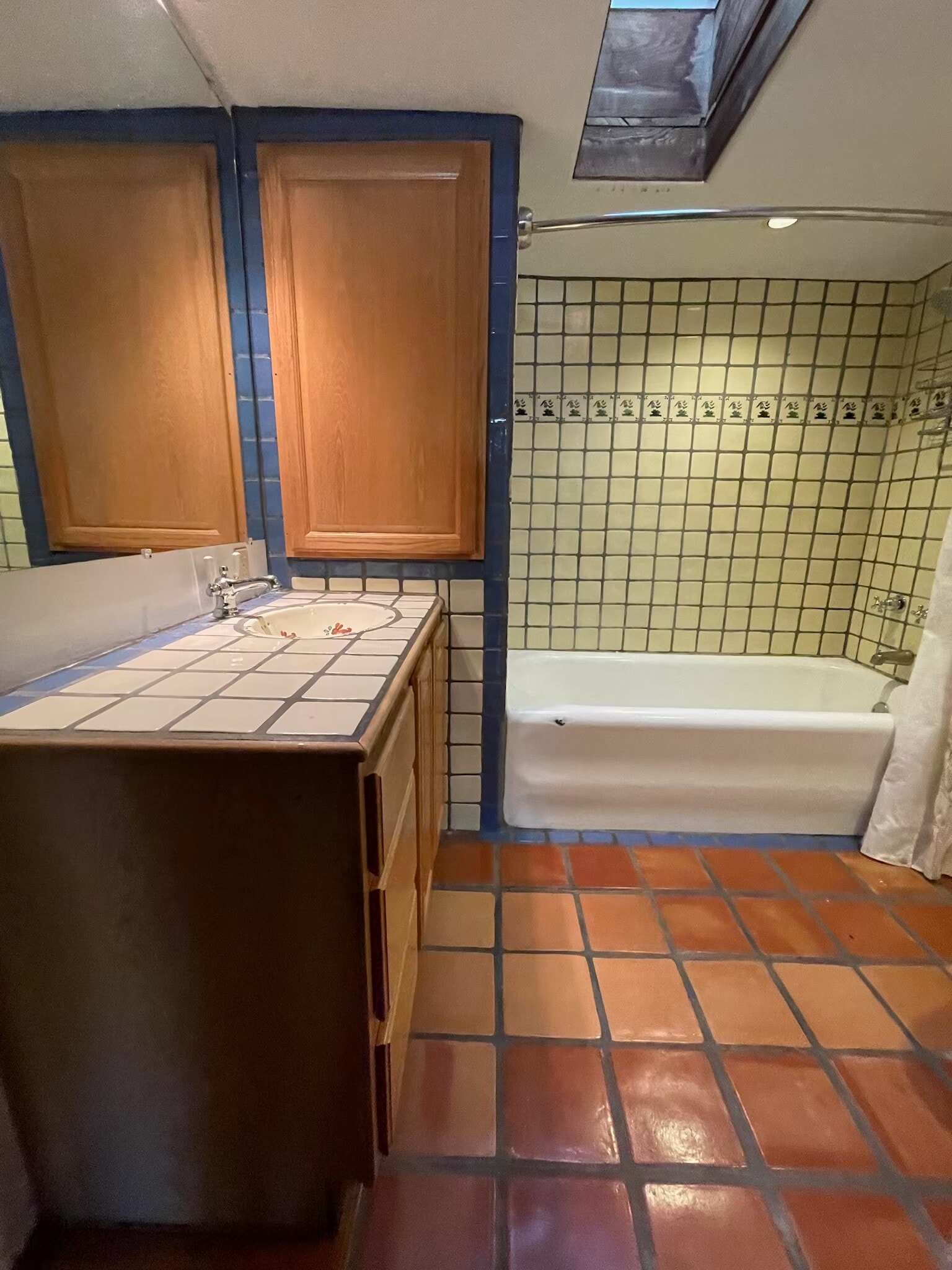 Santa Fe-style bathroom with big tub, skylight, washer/dryer and storage - 1470B Bishops Lodge Rd