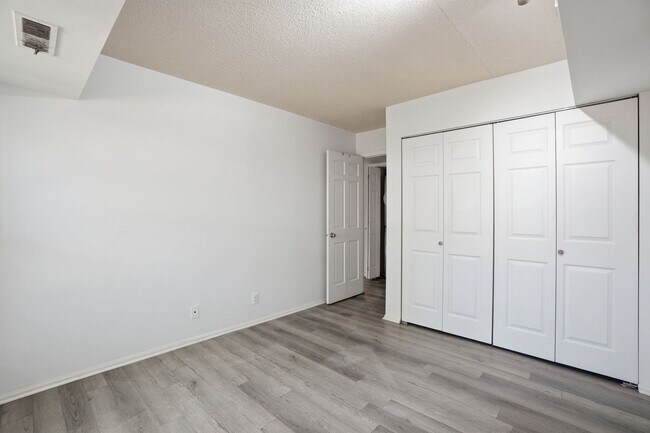 Building Photo - This expansive ground level residence is set within a serene, gated garden community surrounded b...