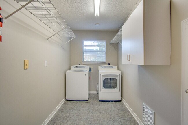 Building Photo - Live the Gulf Breeze Waterfront Life – Dock, Canal Access & Boat Lift!