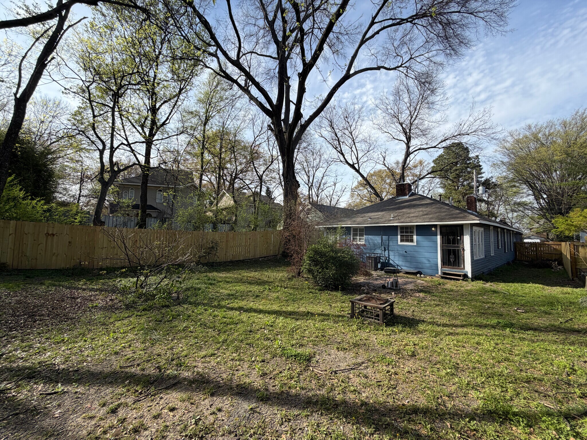 View of the back of the home from the corner of the property. - 2485 Harvard Ave