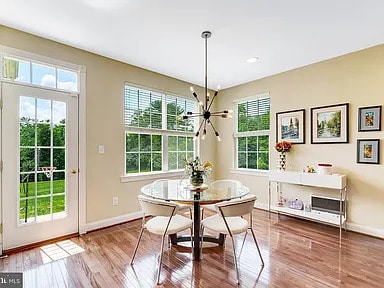 Building Photo - A stunning end-unit carriage home with an ...