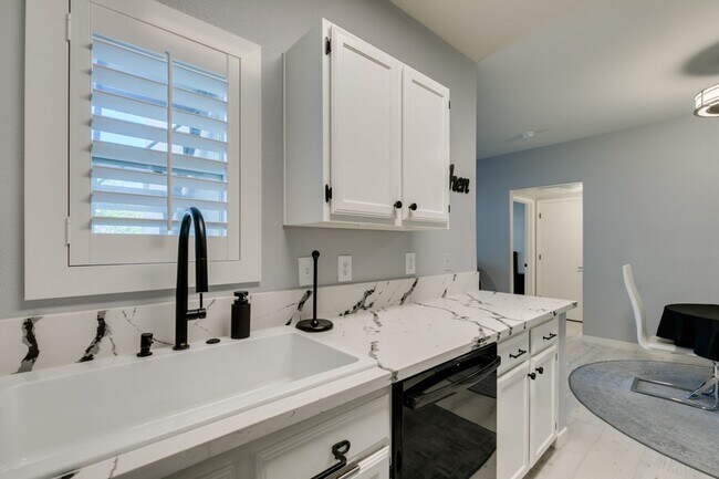Building Photo - Stylish Fully Furnished 1BR Condo with Private Patio & Custom Closet