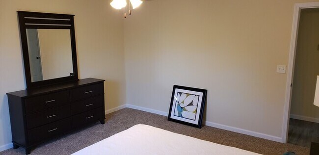 Building Photo - Settle in and cozy up in this comfortable lower-level two-bedroom apartment.