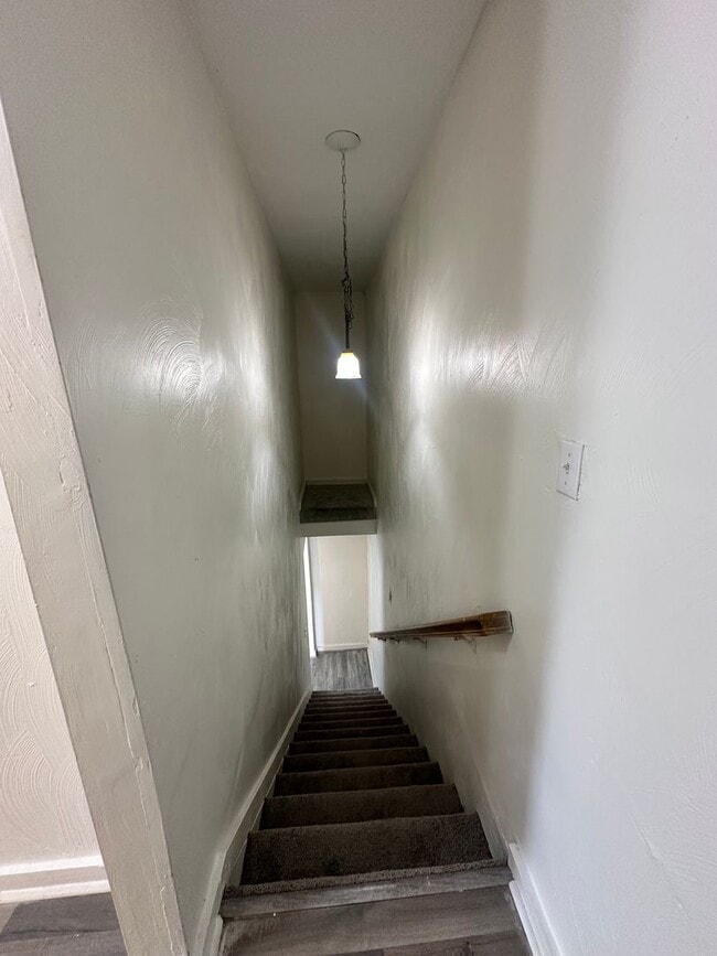 Building Photo - Three Bedroom Available Soon!