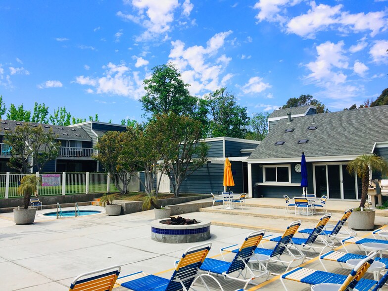 View of the multiple lounging chairs. - 6000 Bixby Village Dr