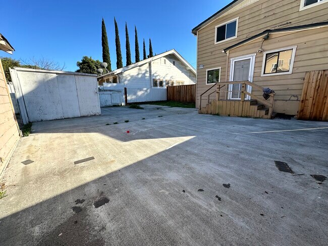 Unit C Entrance, Backyard Patio, Storage and Lawn Area - 656 S 7th St
