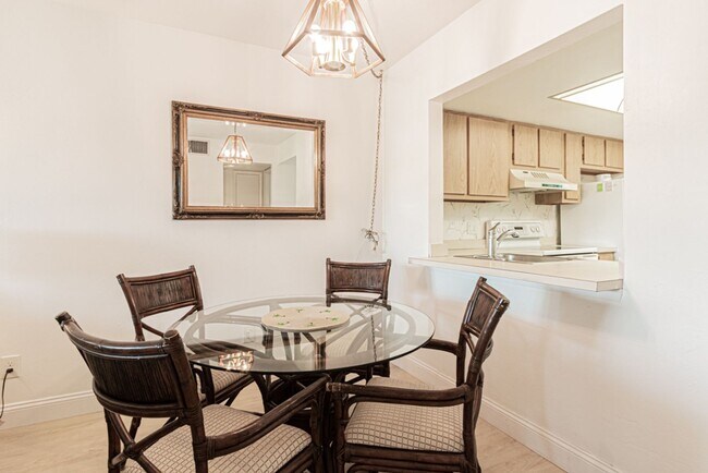 Building Photo - AVAILABLE NOW! Furnished Ground-Floor End Unit | Lake & Pool Views | Minutes to Marco Island & Do...