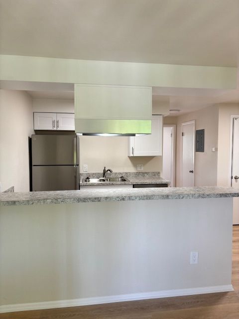 Experience the elegance of a contemporary kitchen with state-of-the-art appliances. - 591 West Prentice Avenue