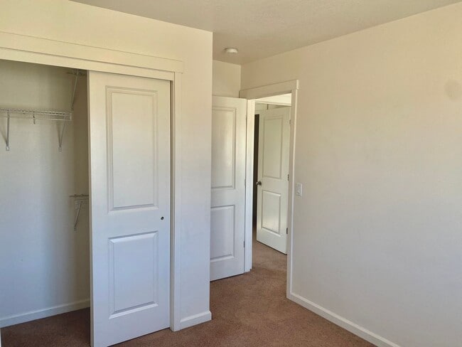 Building Photo - Townhouse Style Home with 3 Bedrooms, 2.5 Bathrooms, and a 2-Car Attached Garage Available in Coe...