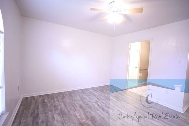 Building Photo - First month move in special $900!! Beautiful 3-bed, 2 bath condo with 2-car garage - includes was...