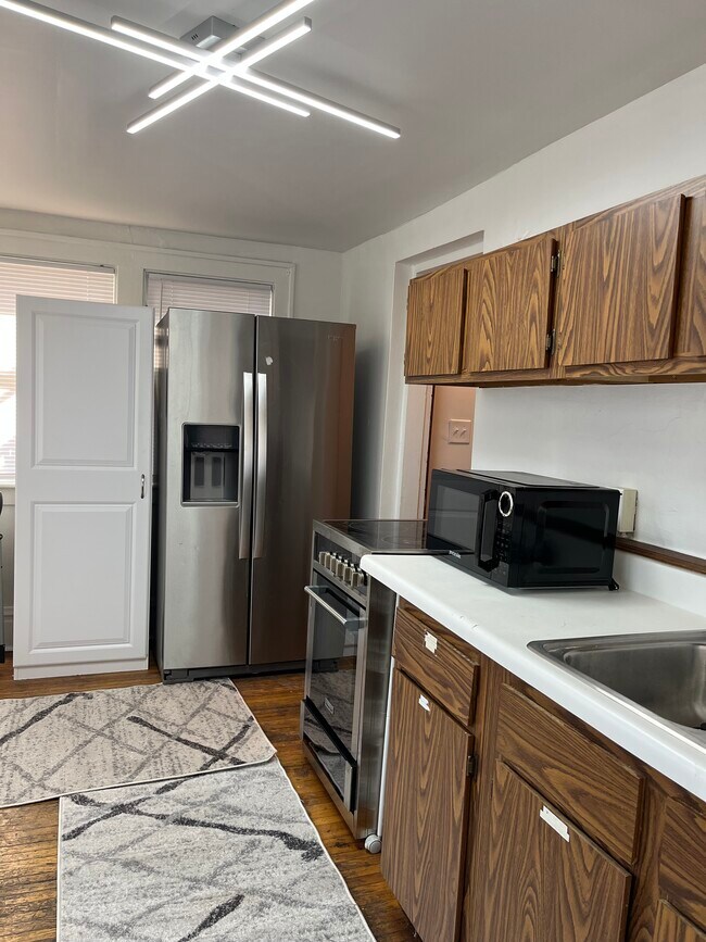 DECOND FLOOR KITCHEN ALL NEW LED LIGHTING AND PLSNTG OF STORAGE! - 32 E Northwood Ave