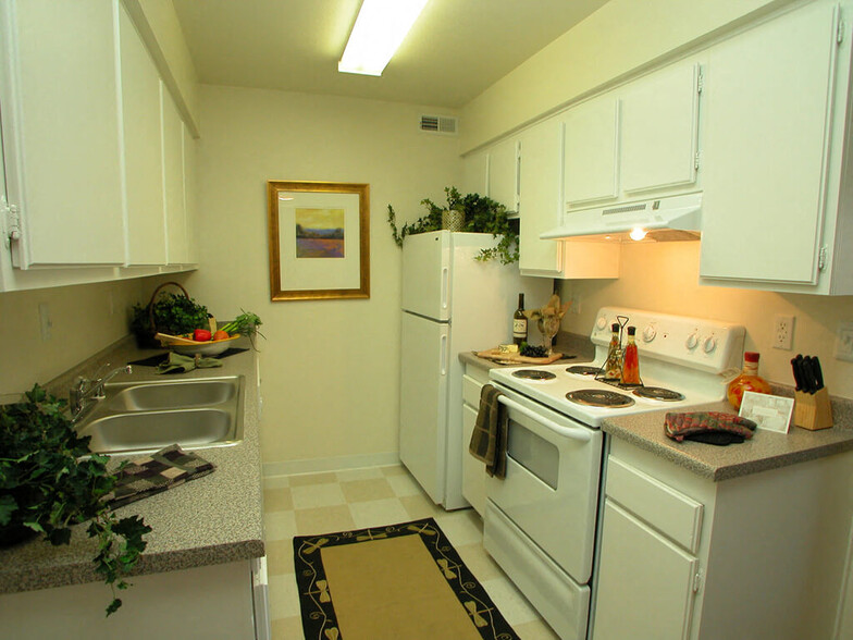 Kitchens include dishwasher and refrigerator - Timberleaf Apartments