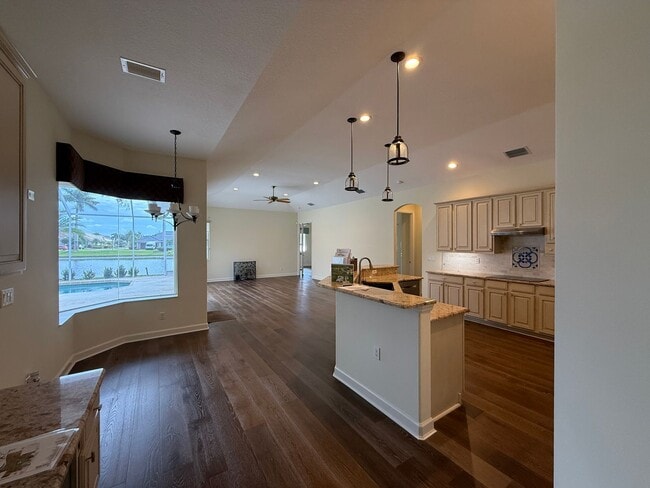 Building Photo - Luxurious 4 Bedroom 3 Bath Lakefront Pool Home W/3-Car Garage