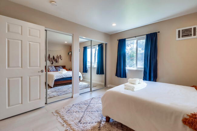 Make use of the spacious closet hidden behind the full-length mirrors in Bedroom 2 - 524 Telegraph Canyon Rd