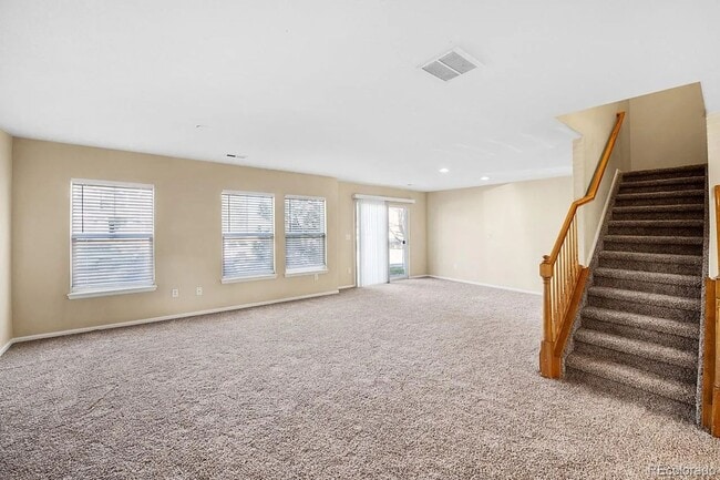 Building Photo - LEASING SPECIAL! Bright Open-Concept Condo with 1-Car Garage in Prime Commuter Location