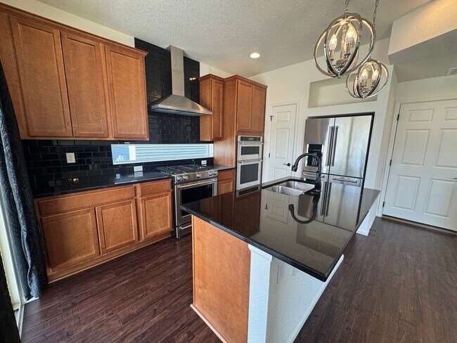 Building Photo - Luxury Corner Lot Home in Banning Lewis with Finished Basement, Wet Bar & Designer Upgrades