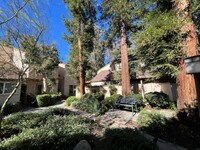 Building Photo - LOCATION! Move-in ready 2+2 w/parking, pool + balcony!