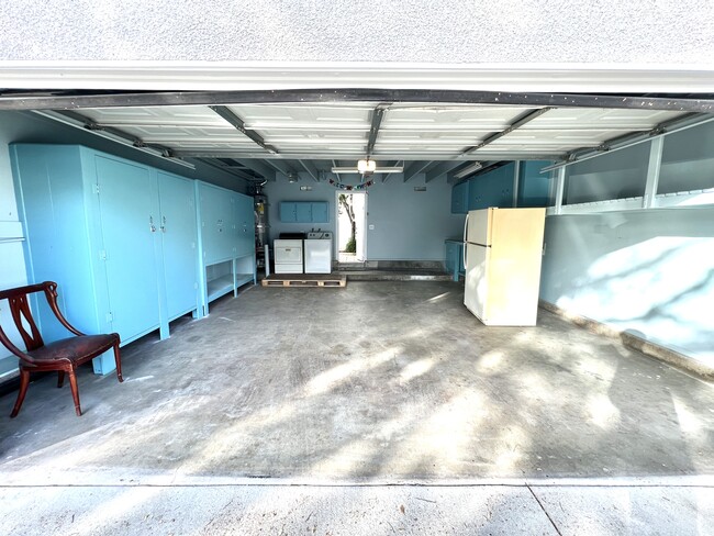 2 Car Garage with plenty of storage and work bench. - 17738 Devonshire St